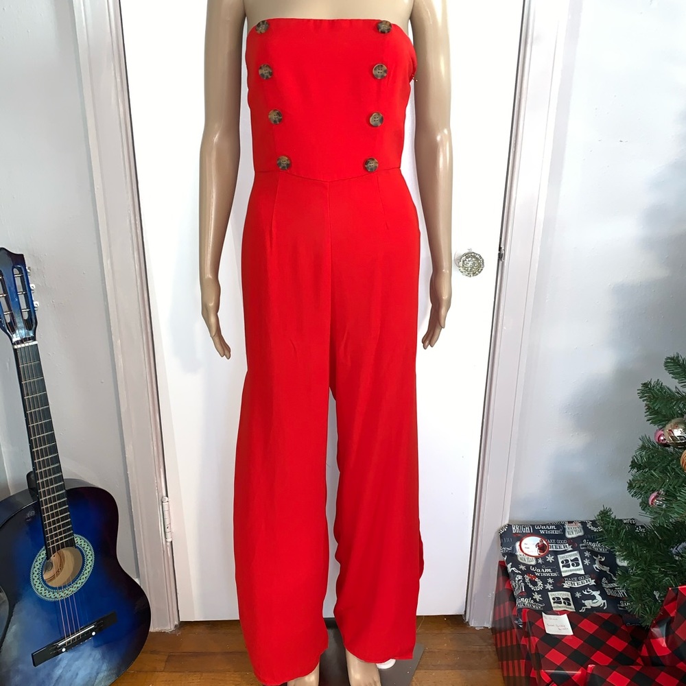 Red flare leg jumpsuit thigh high slits size small